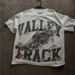 VALE LIVES FOREVER Graphic T-Shirt with Winged Shoe Design